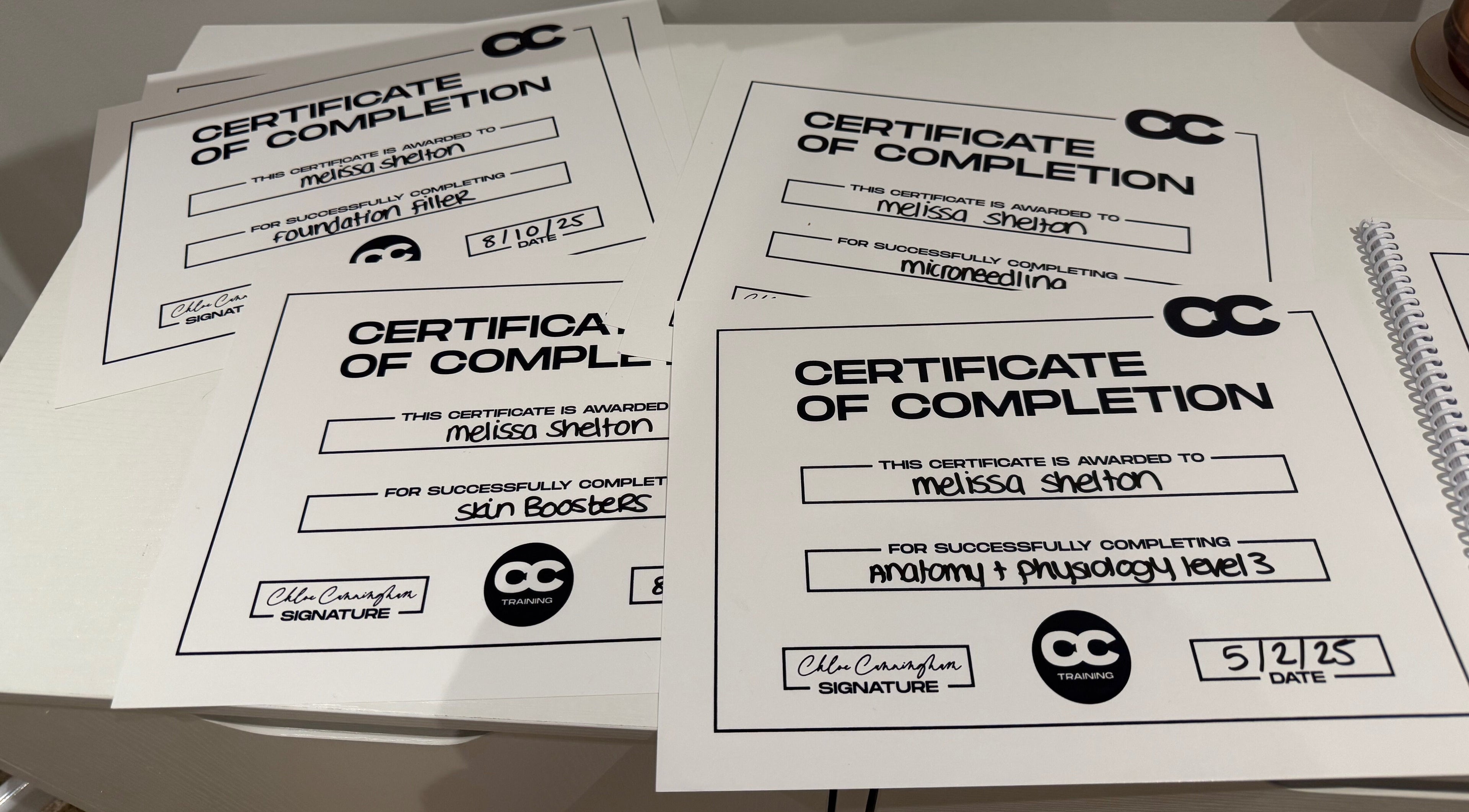 Certificates showcasing training completion at Melted Perfections, Billericay, England, GB.