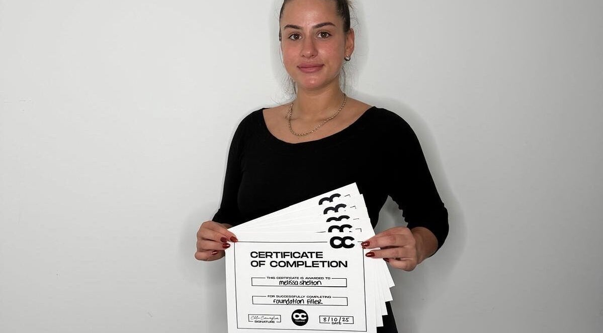 Person proudly displays certification from Melted Perfections, Billericay, England, GB.