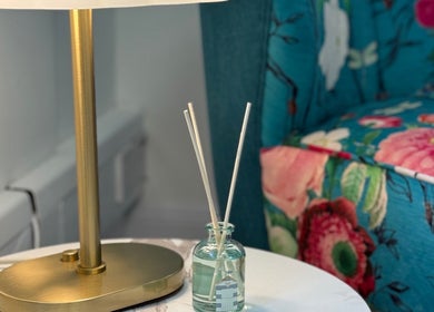 Elegant lamp and floral sofa in The Feel Better Psychological Services, Glasgow, Scotland, GB.