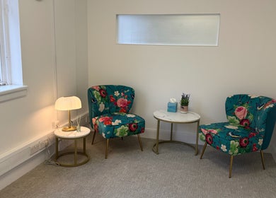 Cozy seating area with floral chairs at The Feel Better Psychological Services, Glasgow, Scotland, GB.