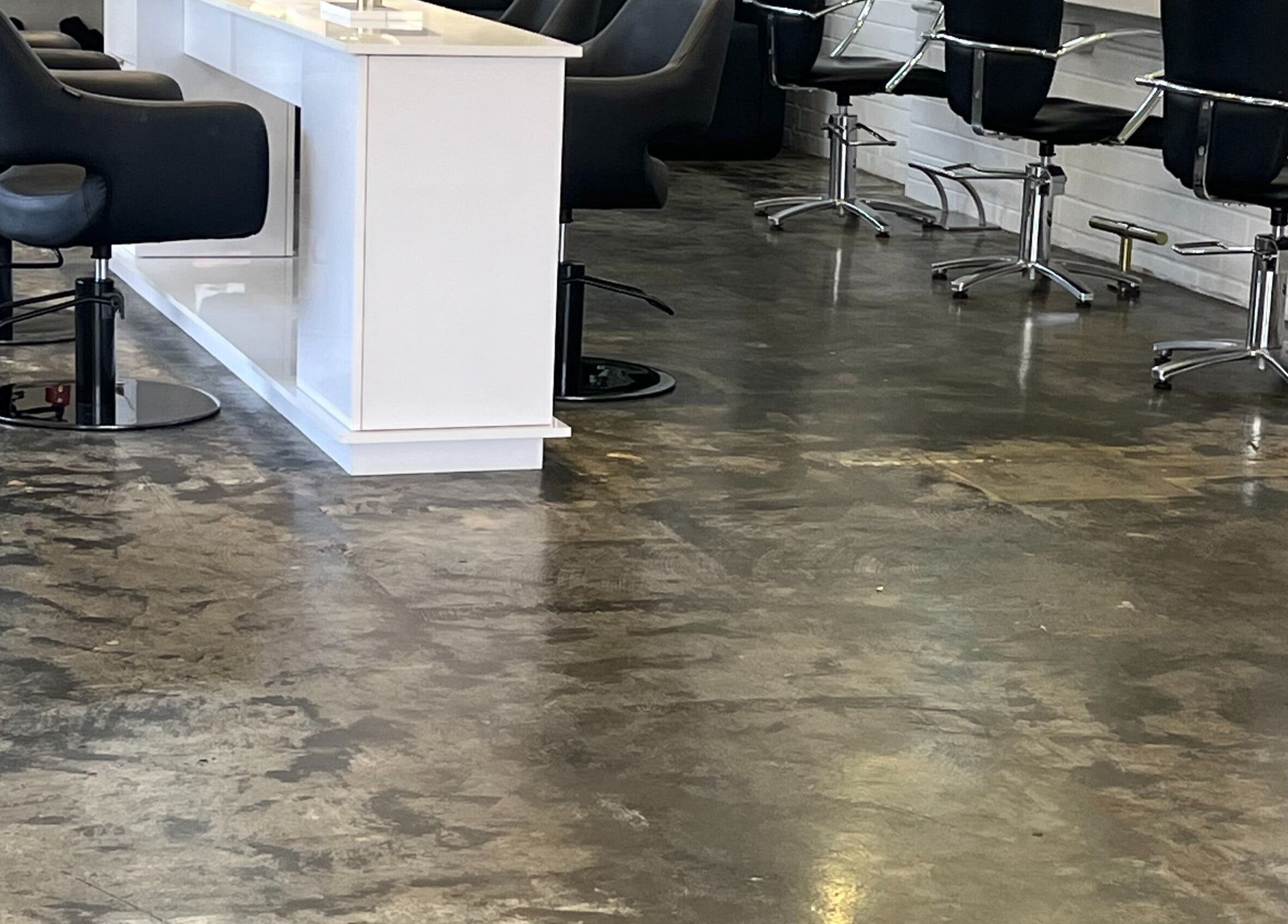 Elegant salon interior with black chairs at NKD Hair Studio, Dianella, Western Australia, AU.
