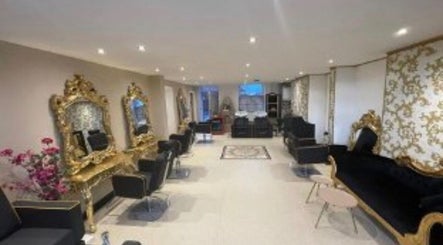 Luxurious salon interior at The Hairdeck in Pudsey, England, GB with ornate mirrors and plush seating.
