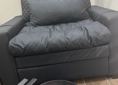 Luxurious armchair at SGC Barbershop, Dubai, Dubai, AE, offering premium comfort.