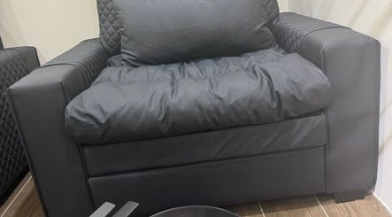 Luxurious armchair at SGC Barbershop, Dubai, Dubai, AE, offering premium comfort.