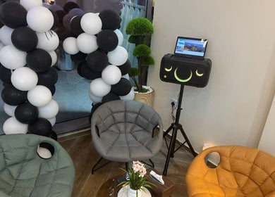 Stylish lounge area at SGC Barbershop, Dubai, Dubai, AE, with modern chairs and vibrant decor.