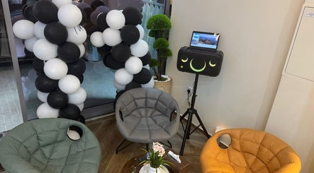 SGC Barbershop waiting area in Dubai, Dubai, AE with cozy chairs and stylish decor.