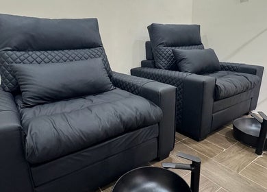 Luxurious black chairs at SGC Barbershop, Dubai, Dubai, AE, offering premium comfort for grooming services.