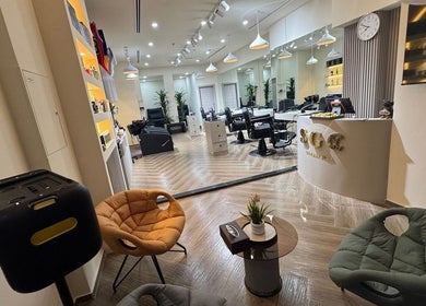 Elegant interior of Sgc Barbershop in Dubai, Dubai, AE showcasing modern chairs and stylish decor.