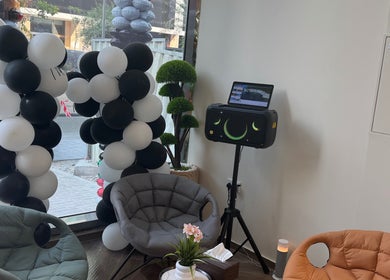 Chic lounge with black and white balloons at Sgc Barbershop, Dubai, Dubai, AE offering a welcoming atmosphere.