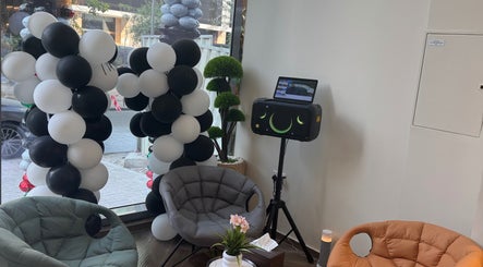 Chic lounge with black and white balloons at Sgc Barbershop, Dubai, Dubai, AE offering a welcoming atmosphere.