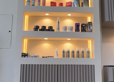 Product shelves at Sgc Barbershop, Dubai, Dubai, AE showcase premium skincare and haircare items.