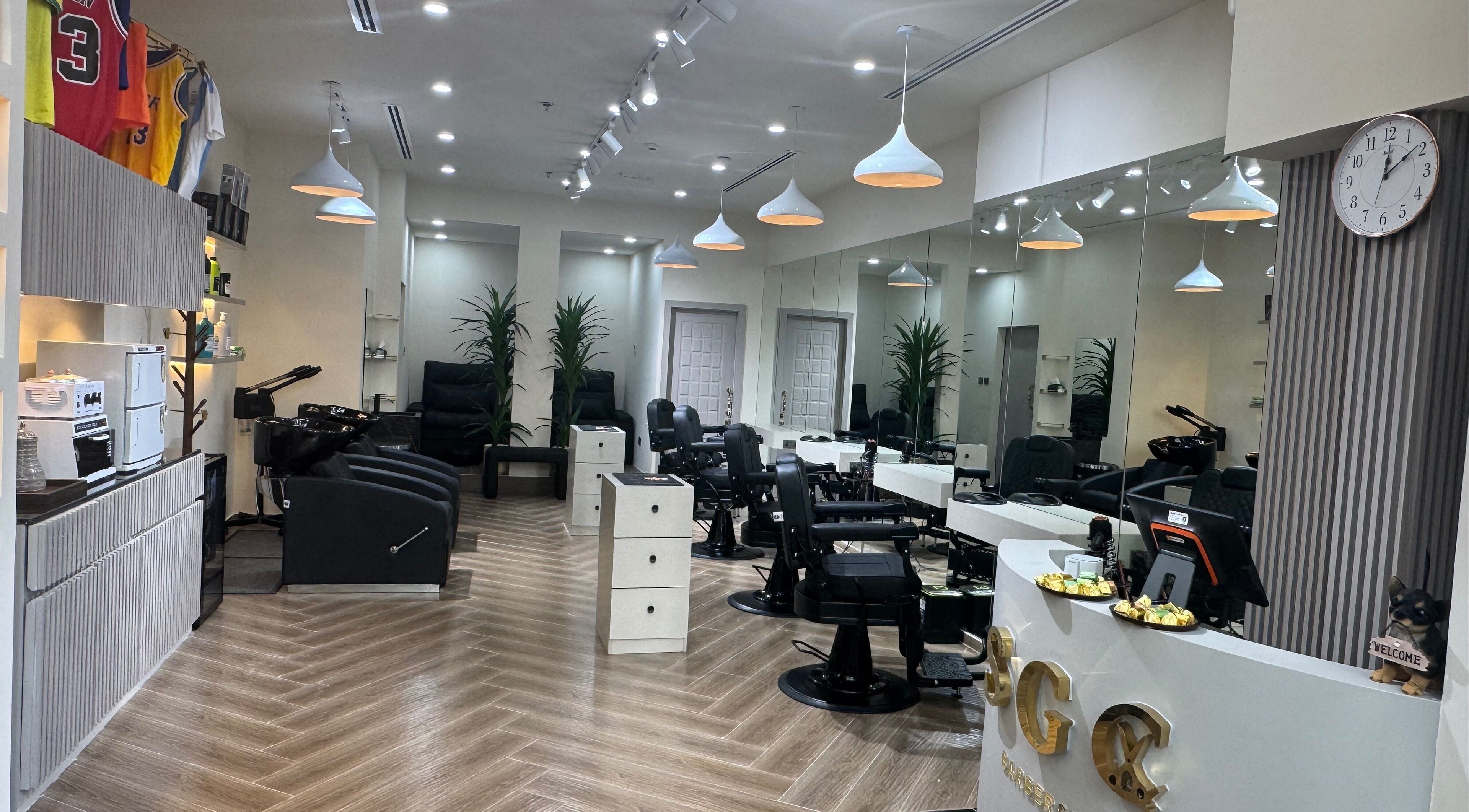 Interior of Sgc Barbershop in Dubai, Dubai, AE with modern decor and styling chairs.