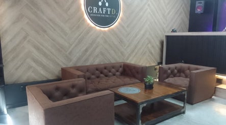 Elegant seating area at CraftD Studios in Randburg, Gauteng, ZA with plush couches and wooden decor.