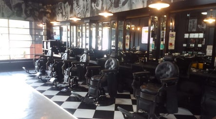 Elegant salon interior at CraftD Studios in Randburg, Gauteng, ZA, showcasing vintage barber chairs and sleek decor.