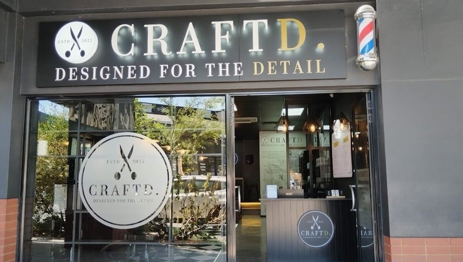 CraftD Studios entrance in Randburg, Gauteng, ZA, showcasing stylish decor and barber pole.