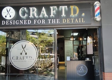 CraftD Studios entrance in Randburg, Gauteng, ZA, showcasing stylish decor and barber pole.