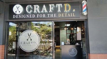 CraftD Studios entrance in Randburg, Gauteng, ZA, showcasing stylish decor and barber pole.