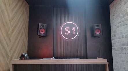 Modern sound system at CraftD Studios, Randburg, Gauteng, ZA, featuring vibrant speakers and neon sign.