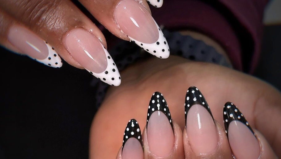 Polka dot nail art at Kimmy Nails Studio, Melbourne, Victoria, AU, showcasing elegant black and white designs.
