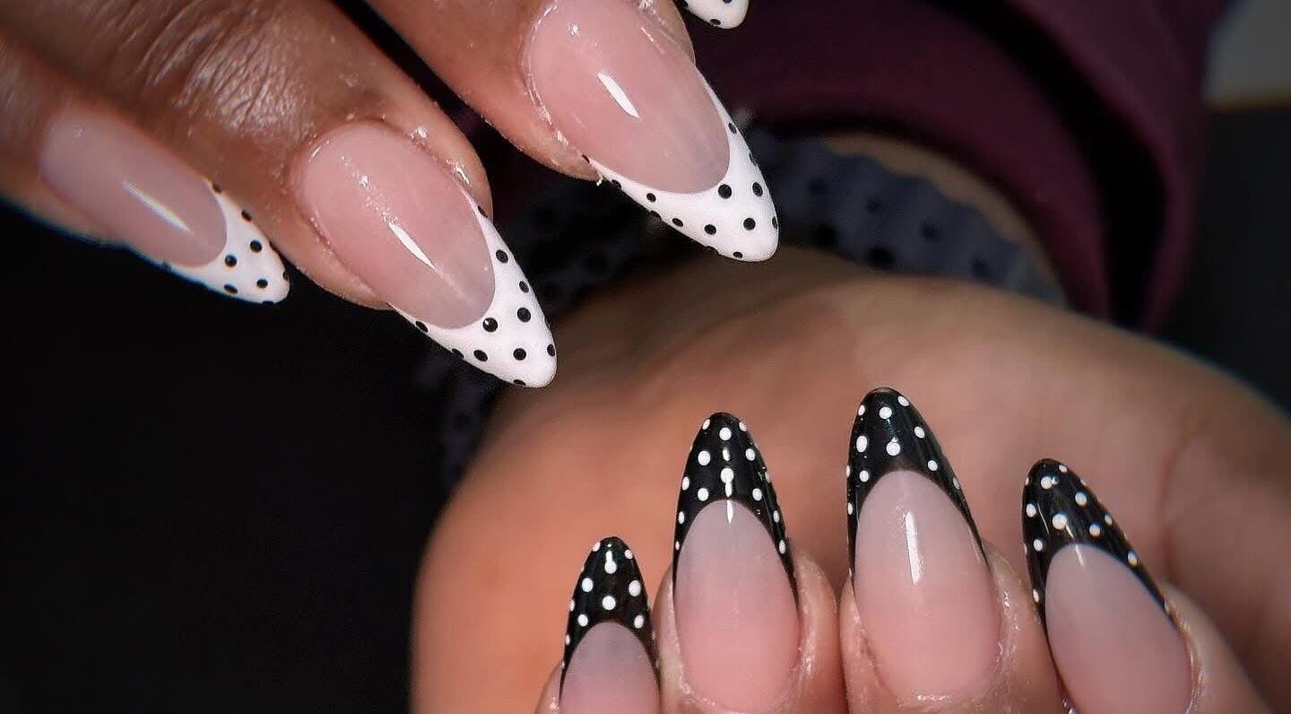 Polka dot nail art at Kimmy Nails Studio, Melbourne, Victoria, AU, showcasing elegant black and white designs.