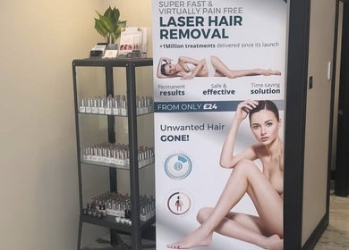Promotional display for laser hair removal at My Skin Sanctuary in Eastbourne, England, GB. Shelf with beauty products.
