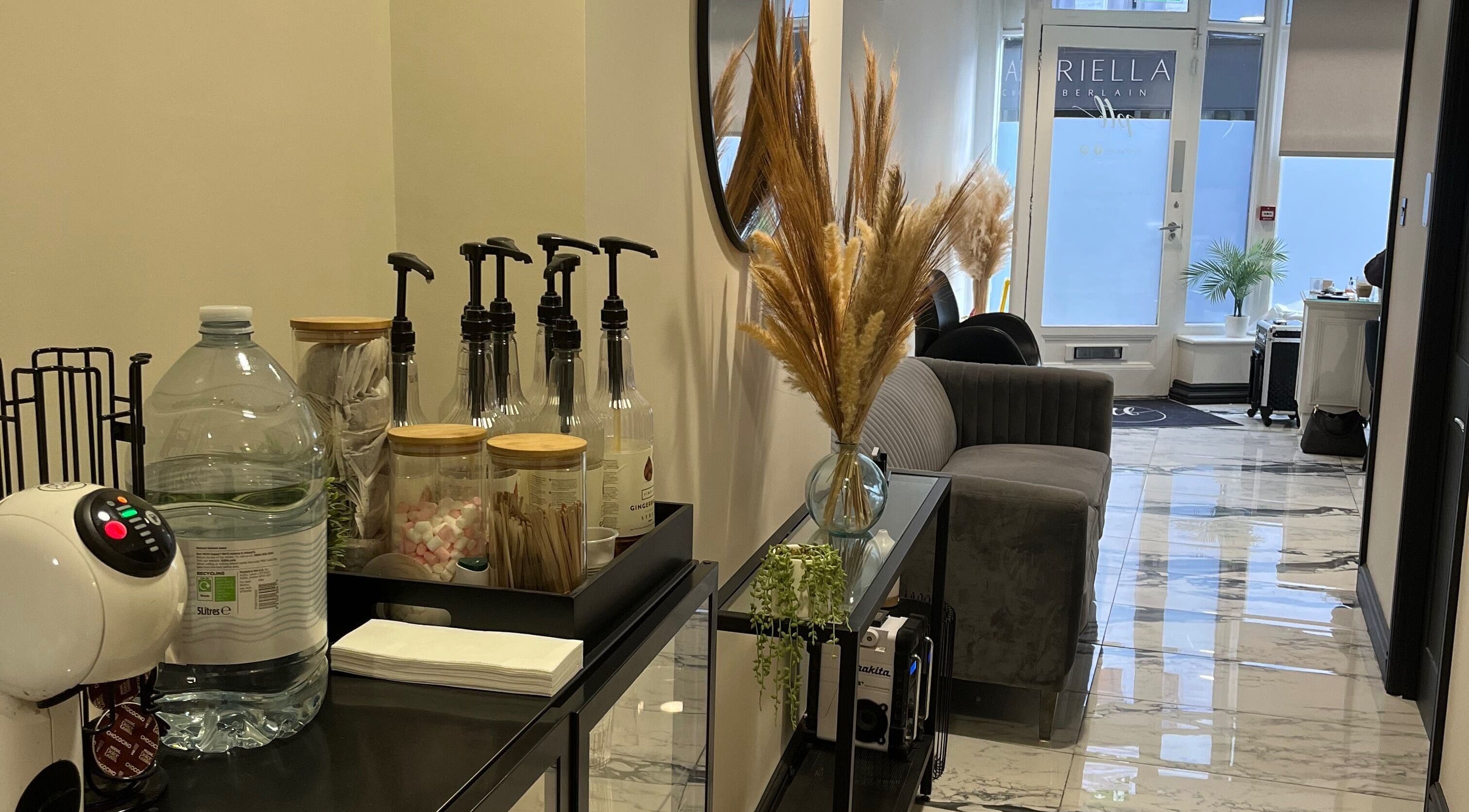 Cozy interior of My Skin Sanctuary, Eastbourne, England, GB with elegant decor and refreshments station.