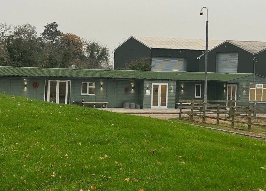 Exterior of The Aesthetics Retreat Academy, nestled in lush greenery in Warburton, England, GB.