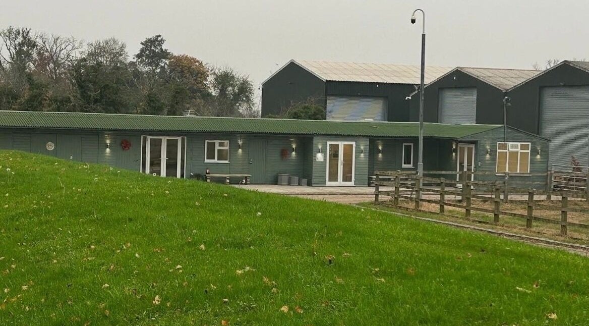 Exterior of The Aesthetics Retreat Academy, nestled in lush greenery in Warburton, England, GB.