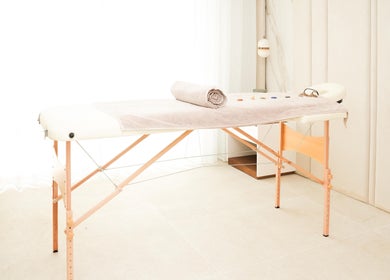 Therapy room at Energy Flow Therapy, Hale, England, GB with massage table and calming decor.