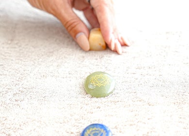Chakra stones used in therapy session at Energy Flow Therapy, Hale, England, GB, promoting balance and tranquility.