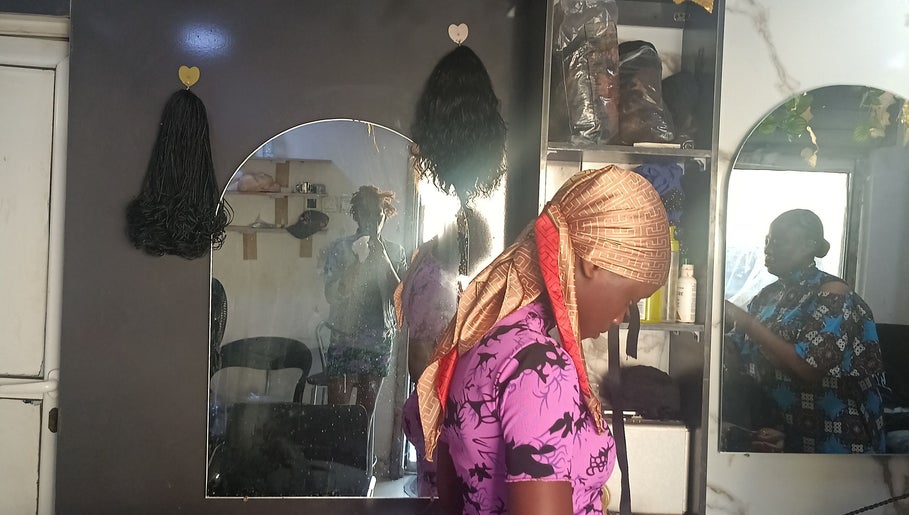 Inside Pink Flame Beauty Salon in Lekki, Lagos, NG, showcasing mirrored reflections and salon decor.