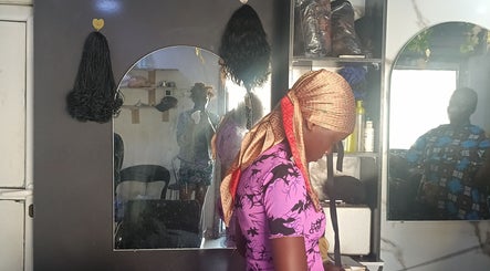 Hair styling area at Pink Flame Beauty Salon, featuring mirrors and tools in Lekki, Lagos, NG.