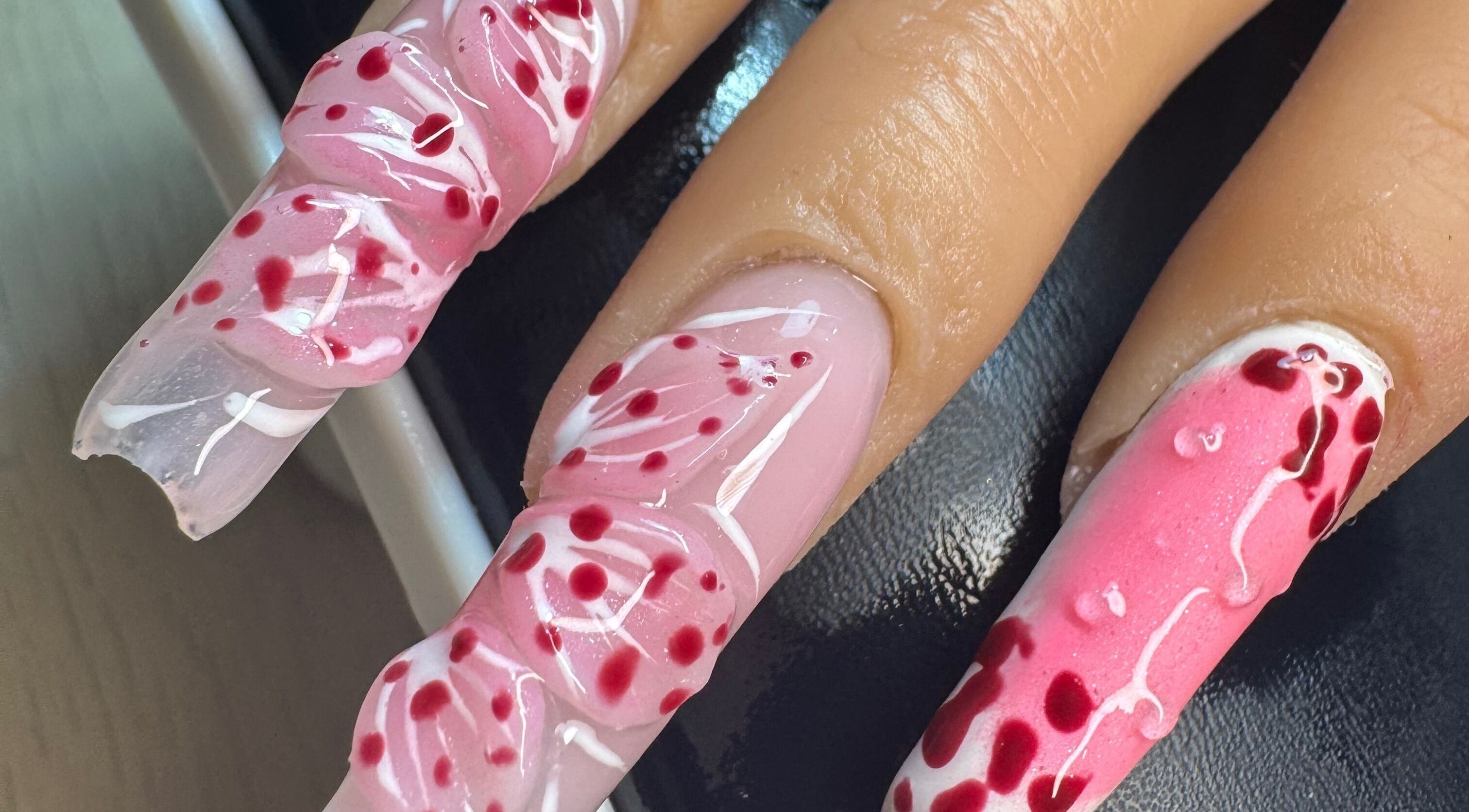 Elegant pink floral nail art at Alsnailsxx, County Longford, IE. Intricate design highlights nail beauty.