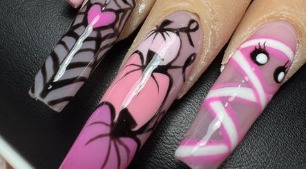 Intricate nail designs at Alsnailsxx in County Longford, County Longford, IE. Vibrant pink and black patterns.