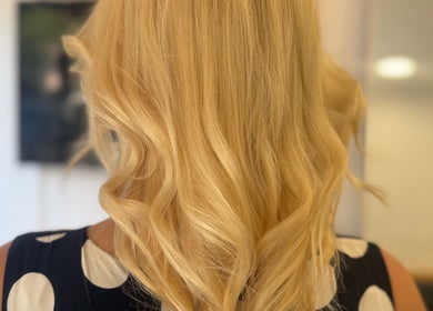 Stylish blonde curls at Hair&Beauty24 in Waltham Abbey, England, GB showcase expert hair styling.