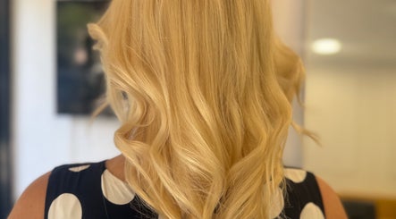 Stylish blonde curls at Hair&Beauty24 in Waltham Abbey, England, GB showcase expert hair styling.