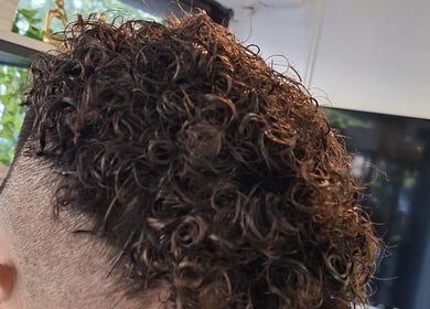 Styled curly haircut at Hair&Beauty24 in Waltham Abbey, England, GB showcasing vibrant curls.
