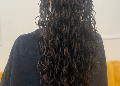 Stylish curly hairstyle at Hair&Beauty24, Waltham Abbey, England, GB. Perfect for enhancing natural beauty.