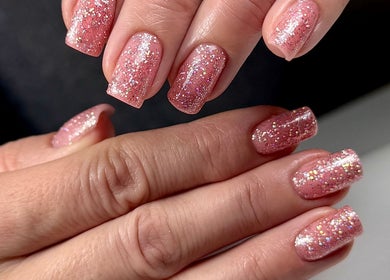 Glittery pink nails manicure at SABeauty, Southborough, England, GB showcasing elegance and style.