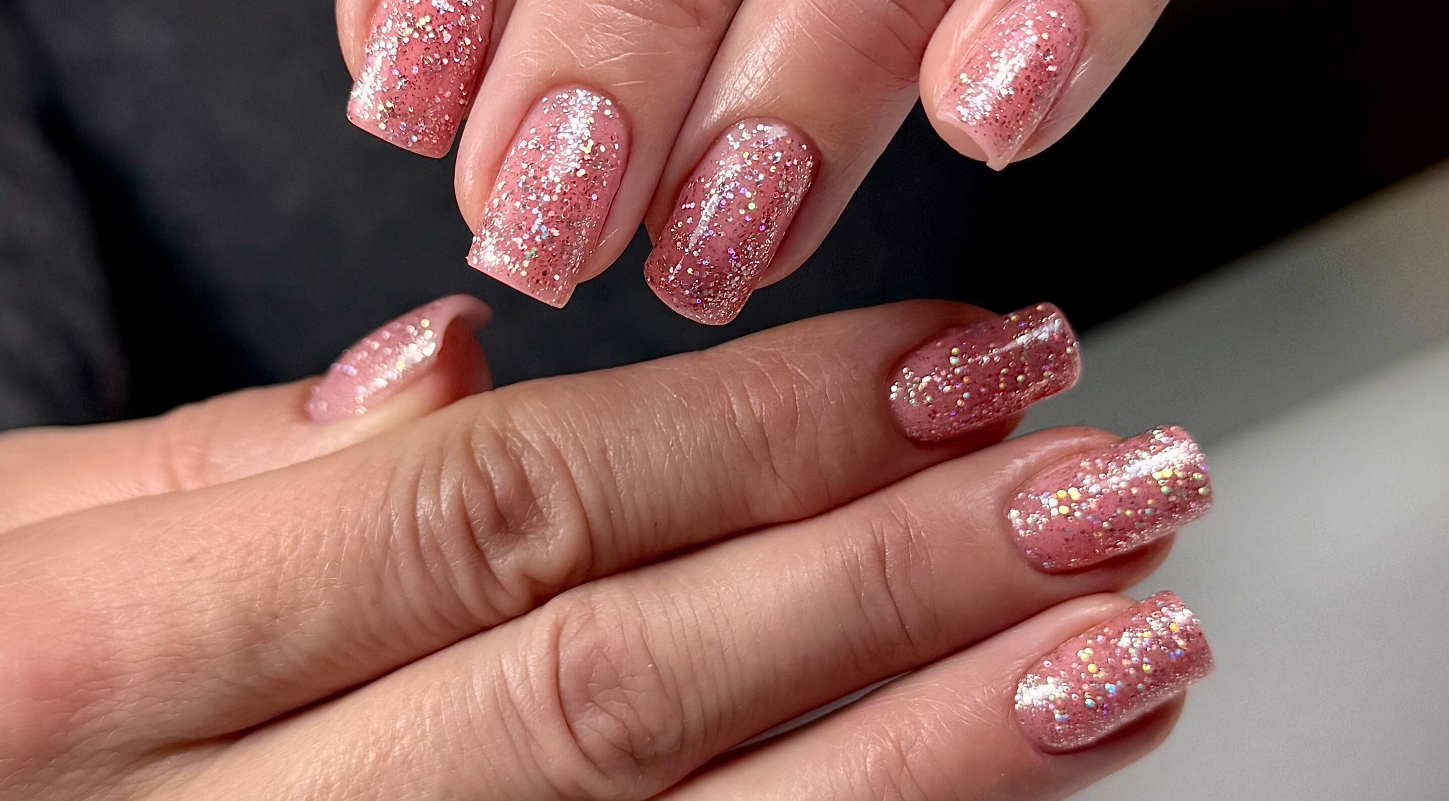 Glittery pink nails manicure at SABeauty, Southborough, England, GB showcasing elegance and style.