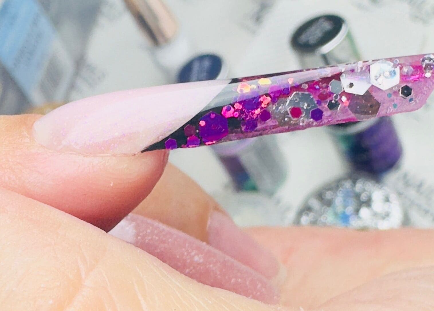 Close-up of glittery pink nail art at SABeauty in Southborough, England, GB. Perfect for fashion-forward looks.