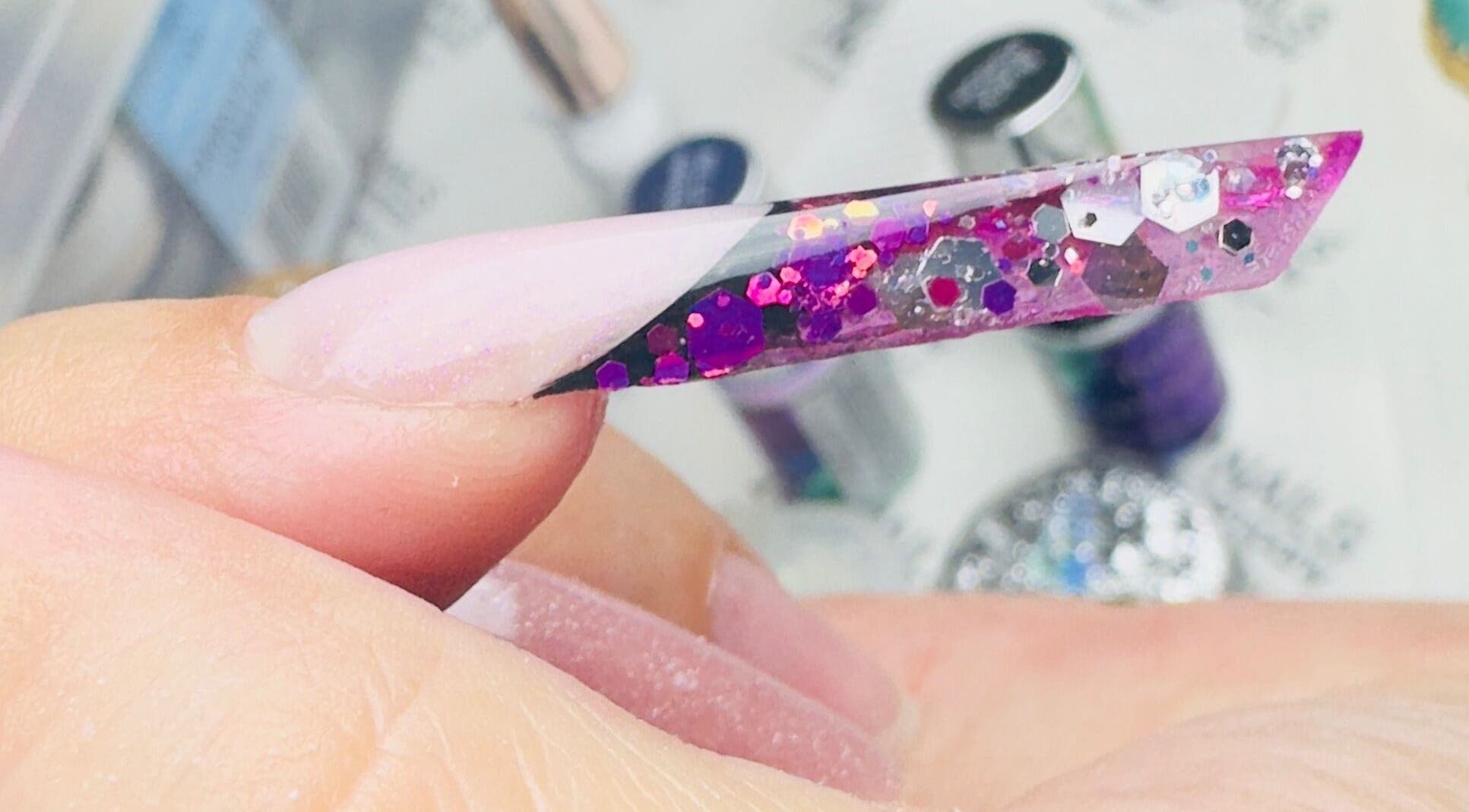 Close-up of glittery pink nail art at SABeauty in Southborough, England, GB. Perfect for fashion-forward looks.
