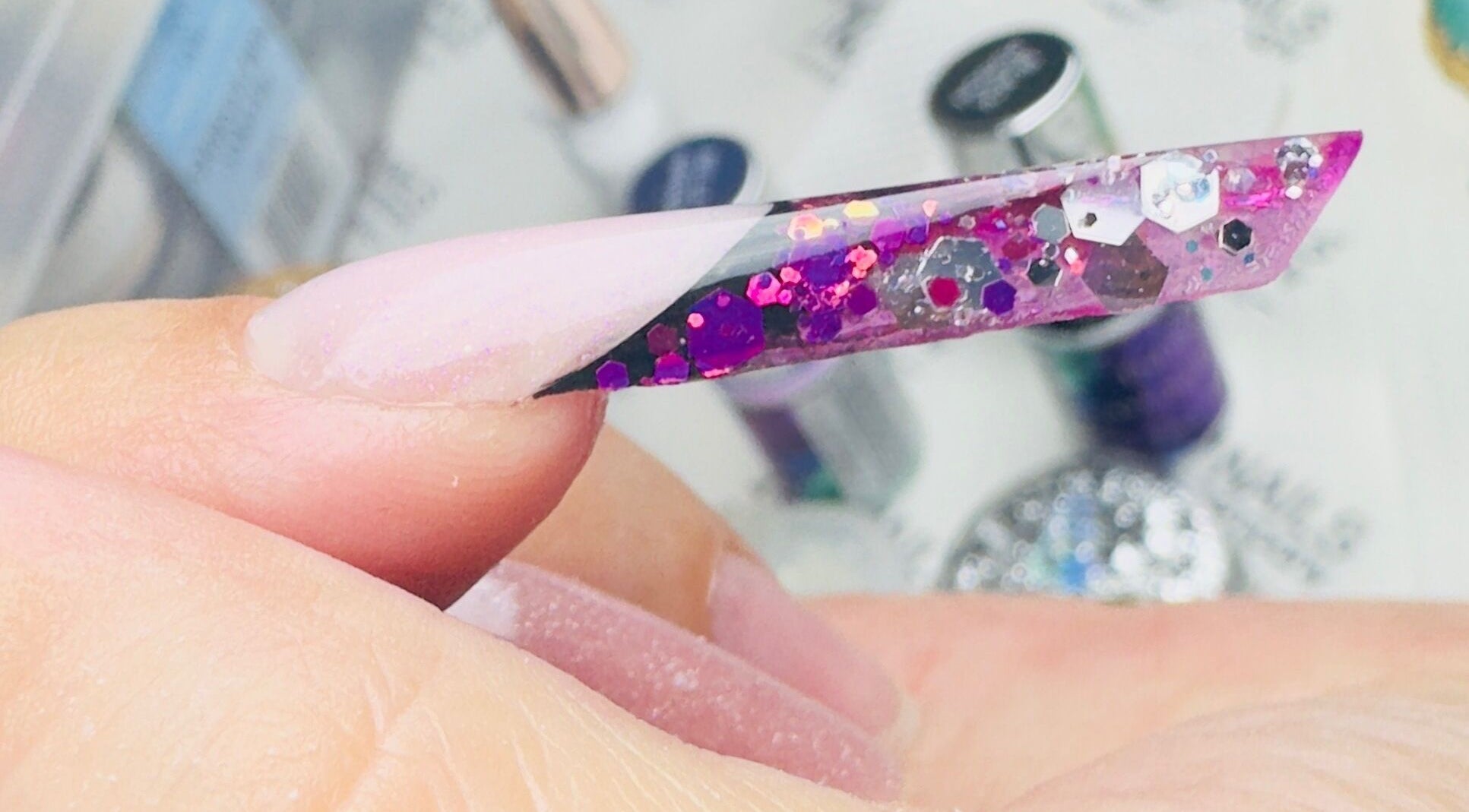 Close-up of glittery pink nail art at SABeauty in Southborough, England, GB. Perfect for fashion-forward looks.