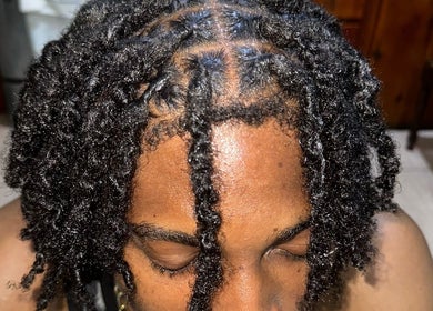 Detailed view of twisted locks hairstyle at Trendsetta_HouseofHair, Portsmouth, Saint John Parish, DM.