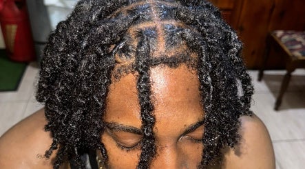 Detailed view of twisted locks hairstyle at Trendsetta_HouseofHair, Portsmouth, Saint John Parish, DM.