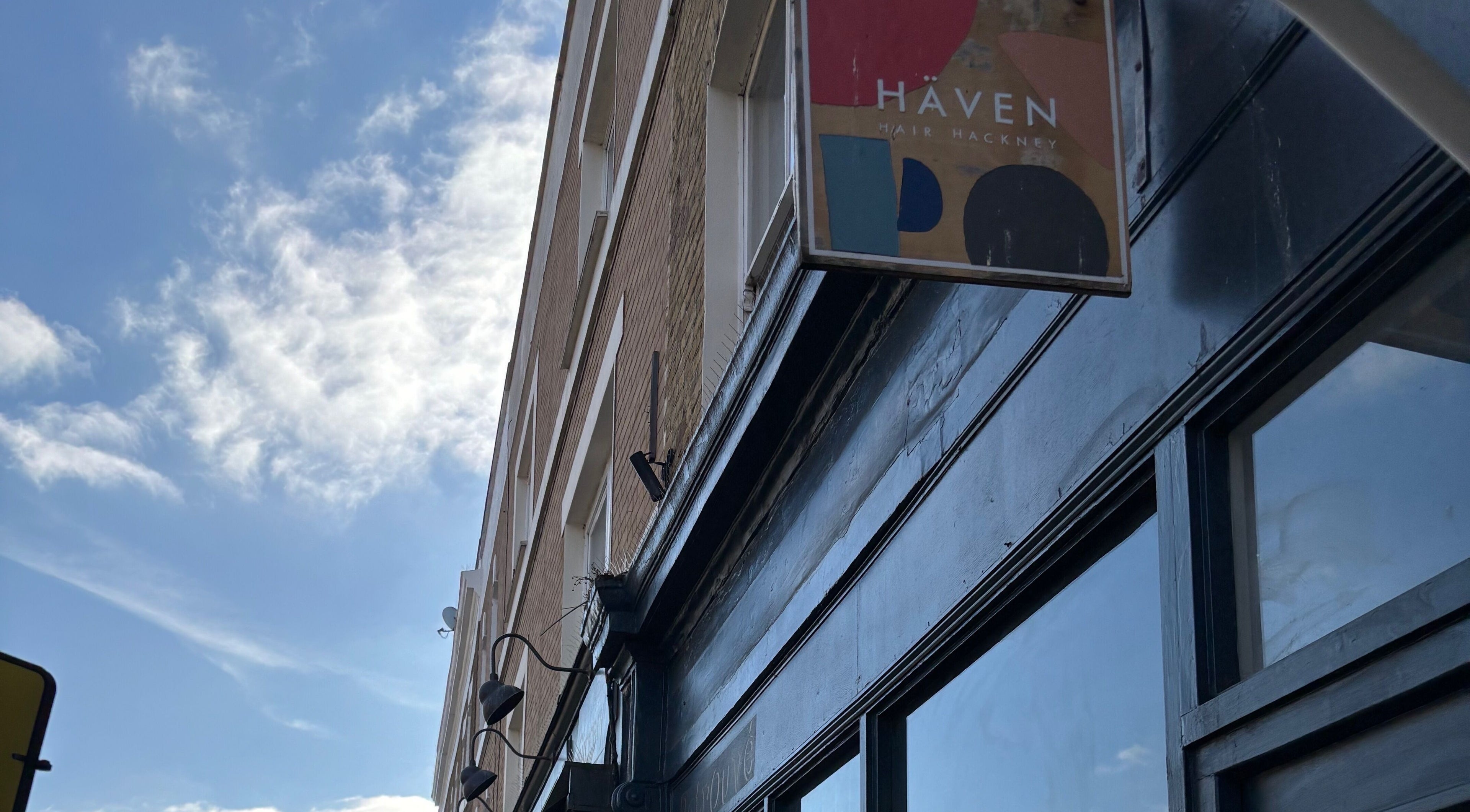 Exterior of Abby Caban Hair in London, England, GB with clear sky backdrop.