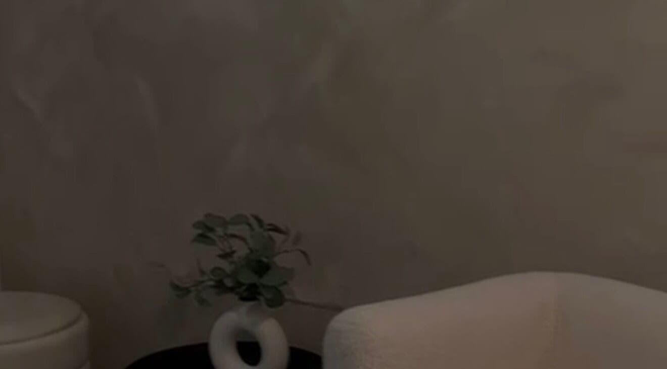 Elegant waiting room at Skin by Nay, Toa Baja, Puerto Rico, PR featuring modern decor and plush seating.