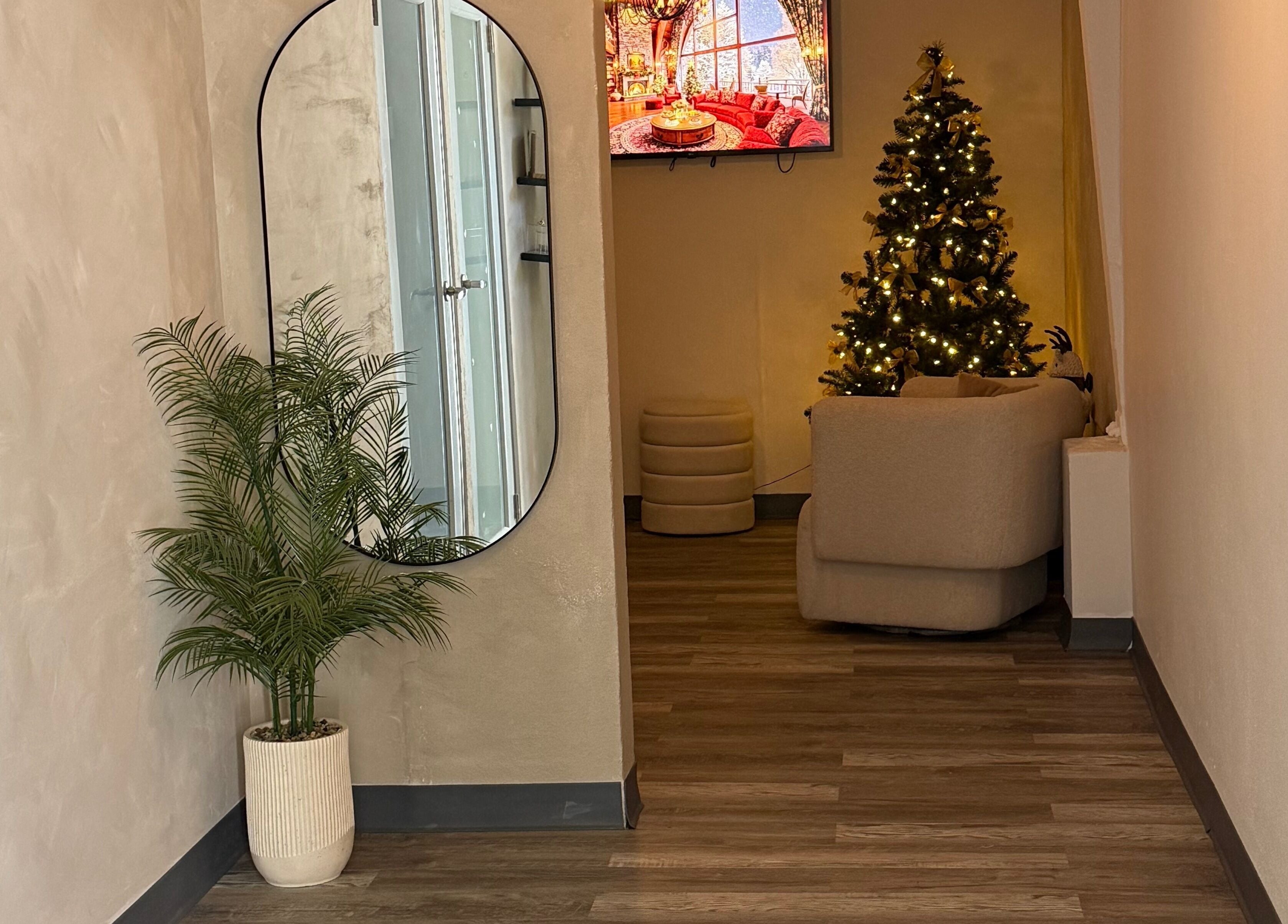 Inviting corner at Skin by Nay in Toa Baja, Puerto Rico, PR with festive decor and a lush plant.