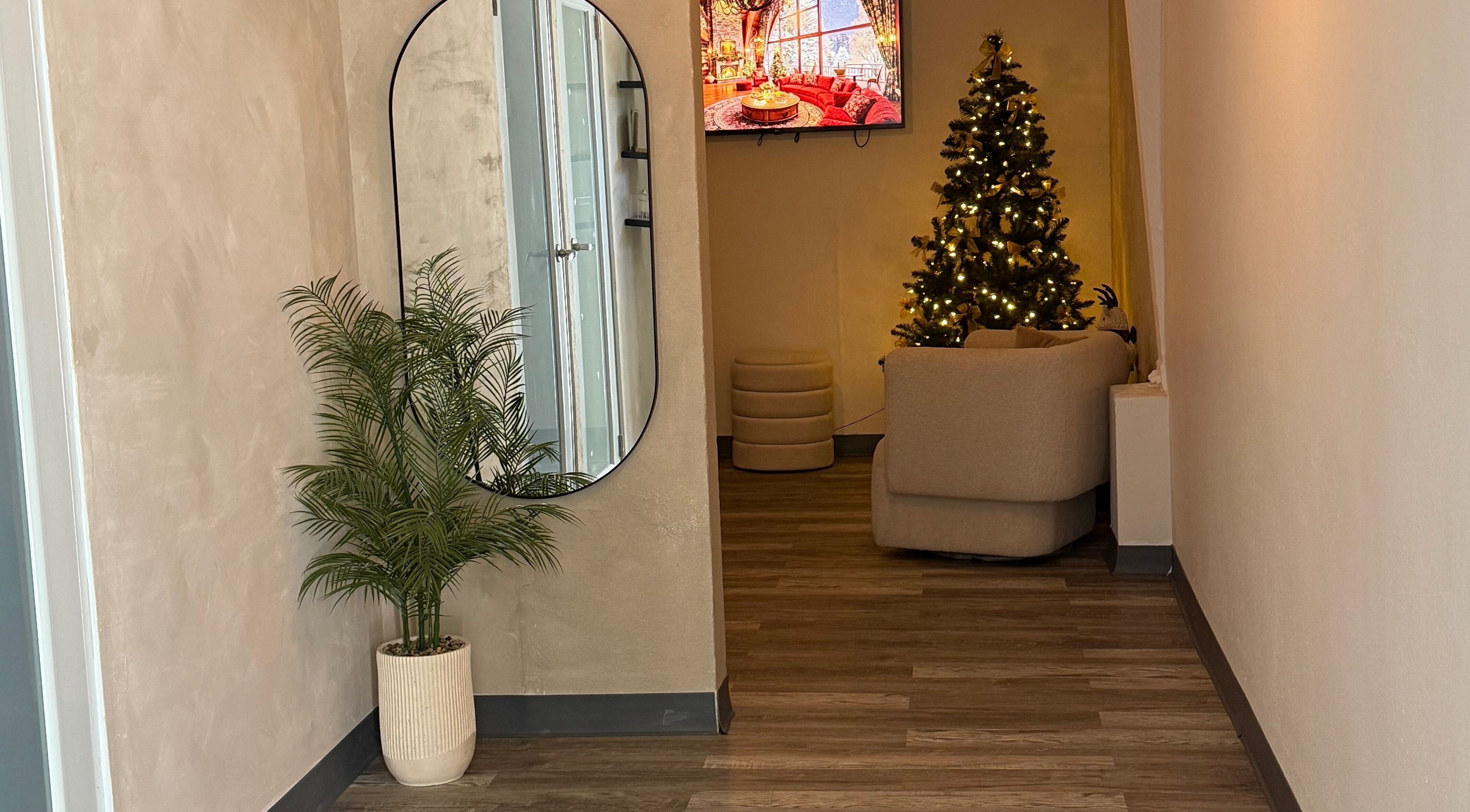 Inviting corner at Skin by Nay in Toa Baja, Puerto Rico, PR with festive decor and a lush plant.