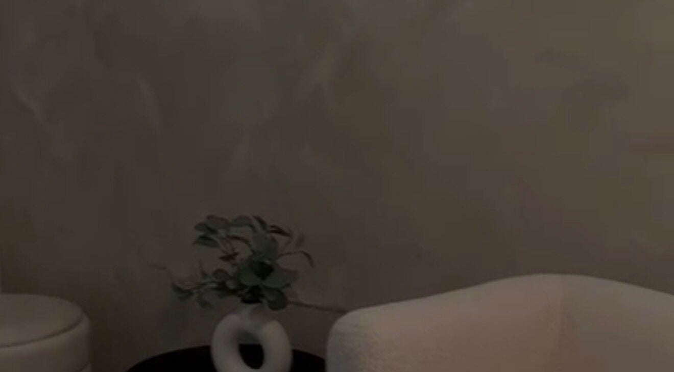 Elegant lounge with sleek furniture at Skin by Nay, Toa Baja, Puerto Rico, PR, offering a serene ambiance.